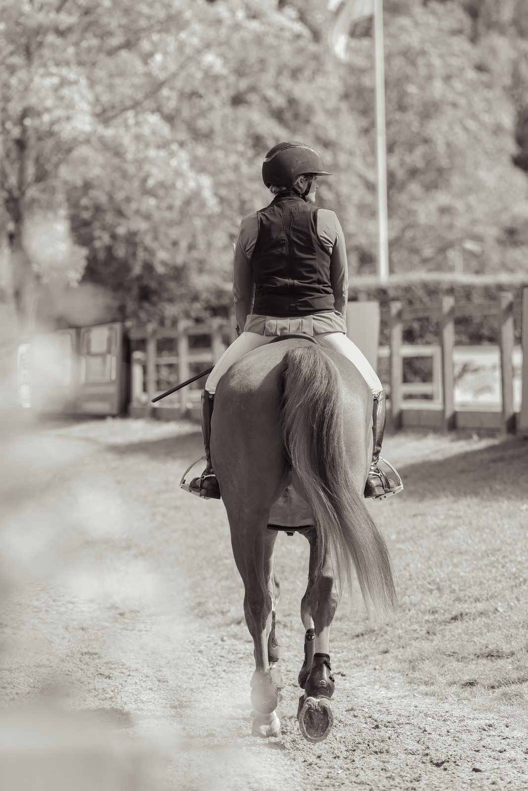 Rider heading back down the lane, black and white